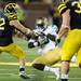 Michigan junior safety Jordan Kovacs ties up Norte Dame ball carrier, running back Cierre Wood during the second quarter against Notre Dame on Saturday. Melanie Maxwell I AnnArbor.com